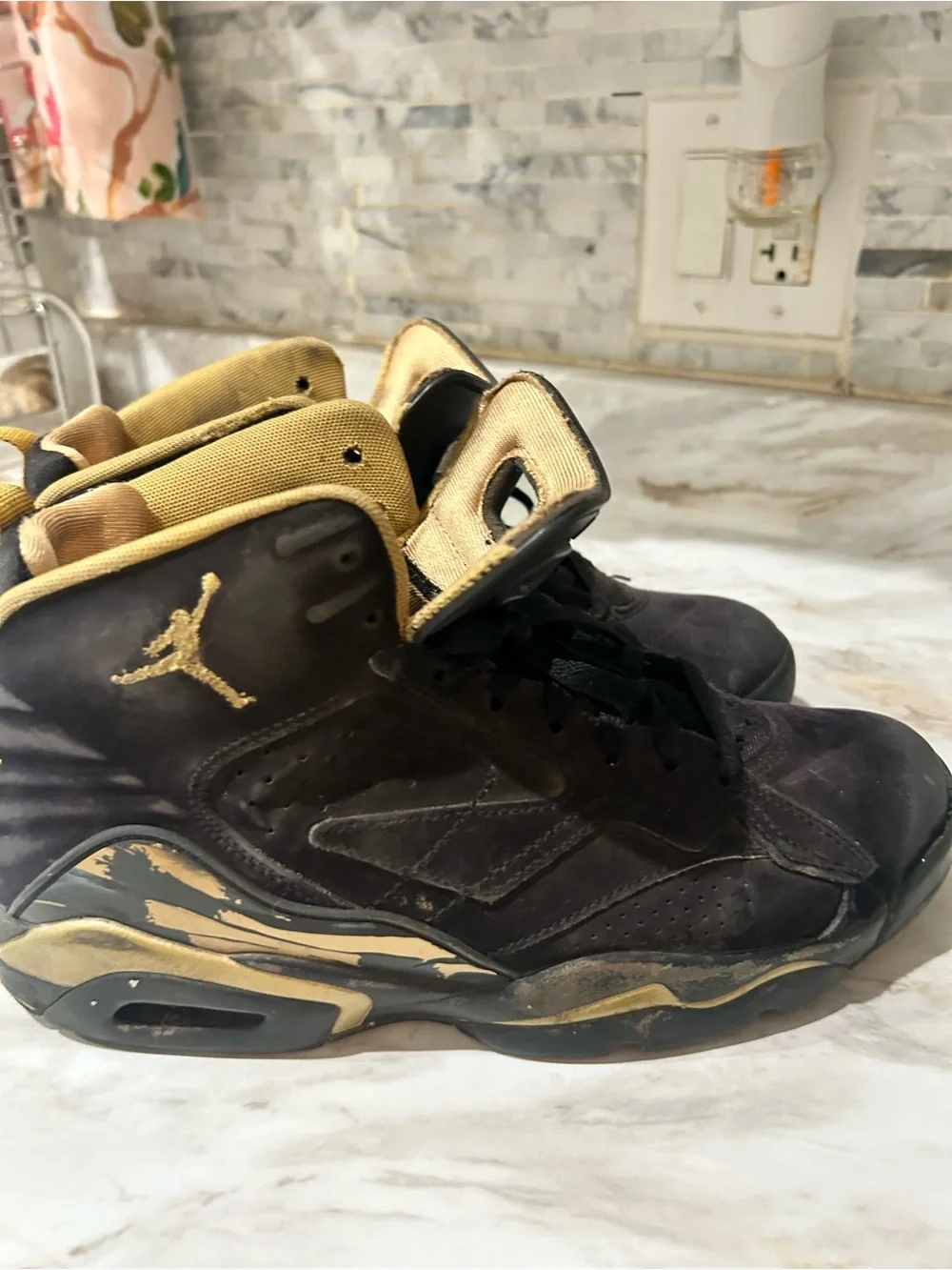 Jordan Black and Metallic Gold High-Top Sneakers